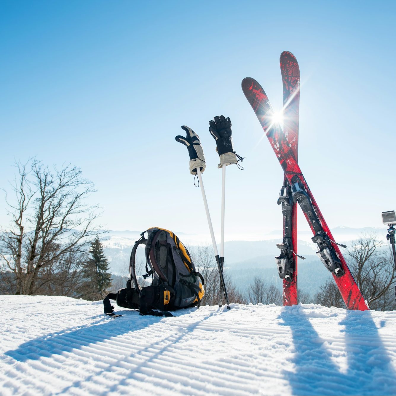 Skis skiing poles and backpack on the mountain